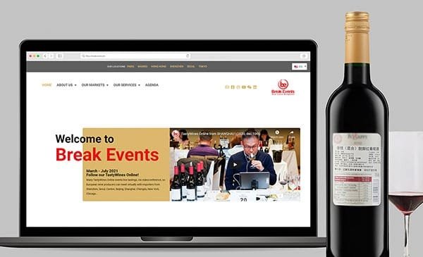 Site web d'un événement sur le vin, création par l'agence de branding Comhit, Paris, sur un écran d'ordinateur portable.